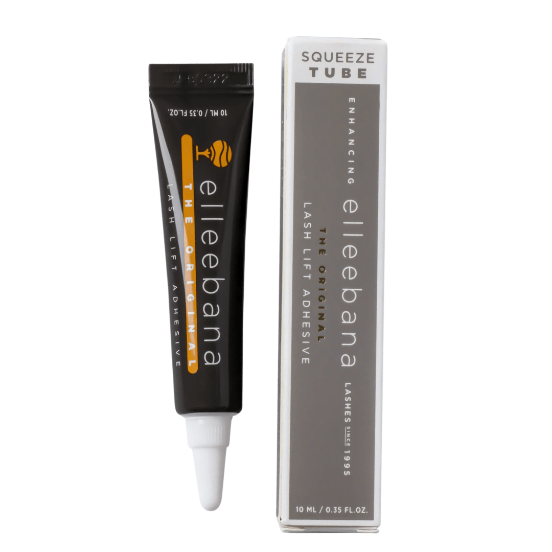 Close-up view of clear Elleebana Lash Lift Glue being dispensed cleanly from the 10ml squeeze tube onto a palette.