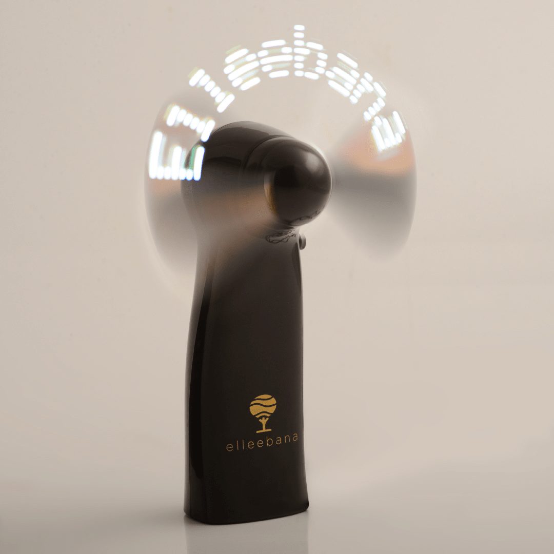 Compact Elleebana LED drying fan displayed in a modern salon setup for filming post-treatment lash and brow reveals.