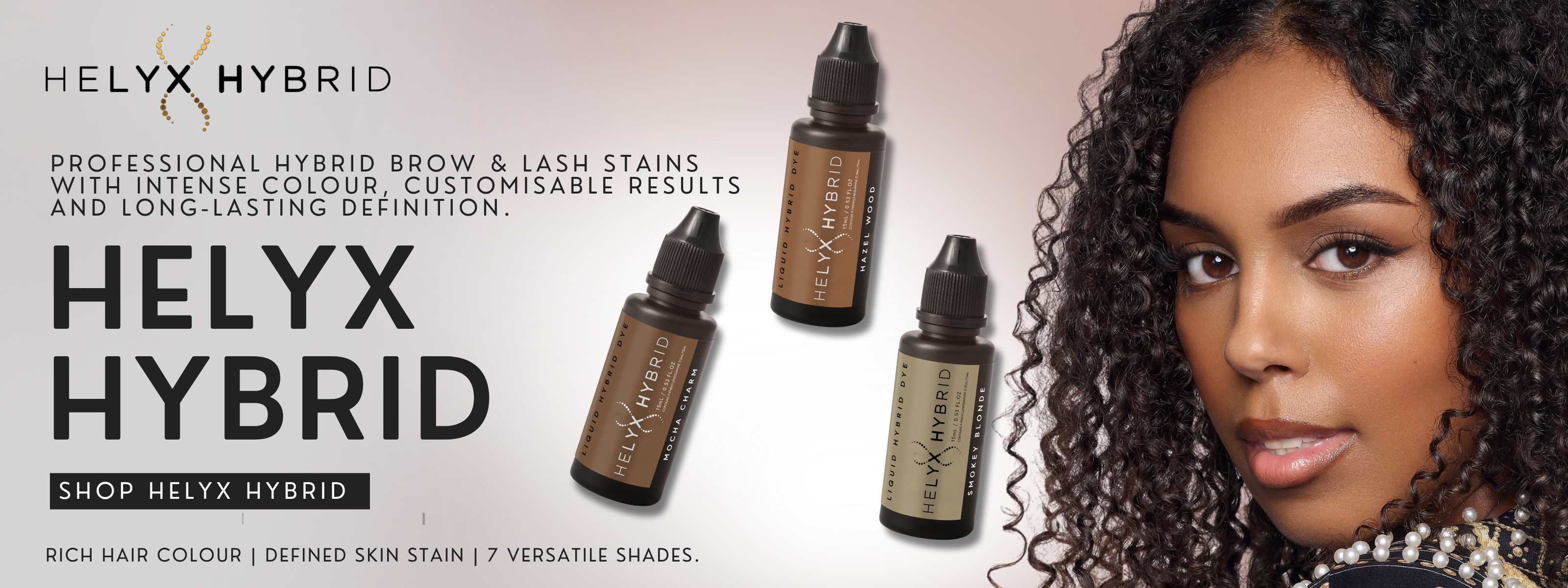 Promotional banner for Helyx Hybrid professional hybrid brow stains, featuring three small Helyx Hybrid bottles and a close-up portrait of a woman with defined dark eyebrows and lashes on a light background.
