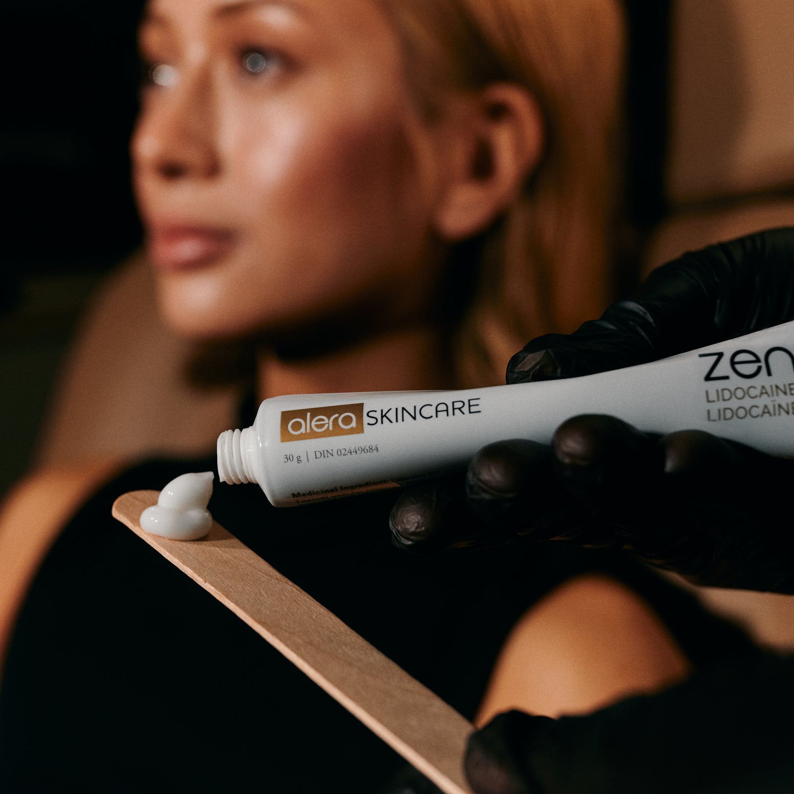 Person applying professional Zensa Numbin cream.
